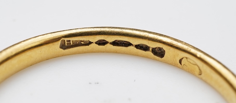 A collection of four gold rings